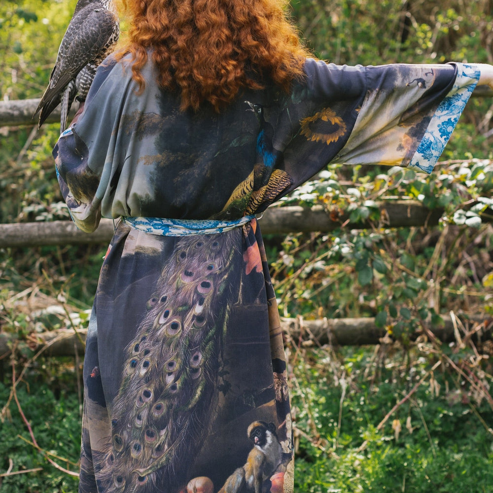 
                  
                    Model wearing Wild Beauty Opera Duster with antique lush florals and peacock – Market of Stars
                  
                