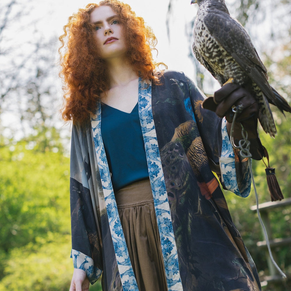 
                  
                    Model wearing Wild Beauty Opera Duster with antique lush florals and peacock – Market of Stars
                  
                