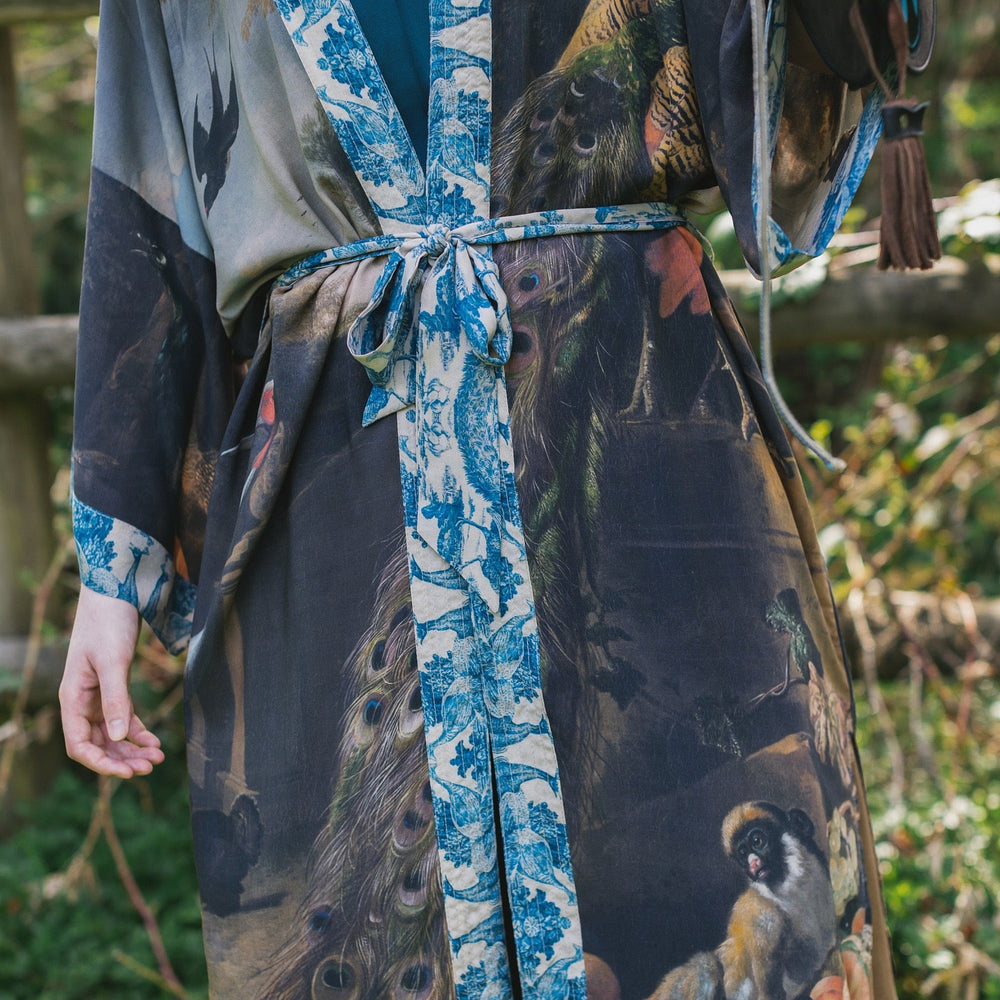
                  
                    Model wearing Wild Beauty Opera Duster with antique lush florals and peacock – Market of Stars
                  
                
