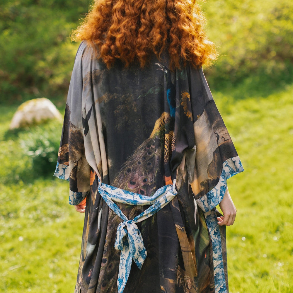 
                  
                    Model wearing Wild Beauty Opera Duster with antique lush florals and peacock – Market of Stars
                  
                