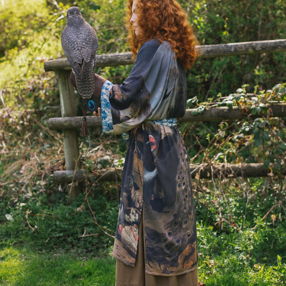 
                  
                    Model wearing Wild Beauty Opera Duster with antique lush florals and peacock – Market of Stars
                  
                