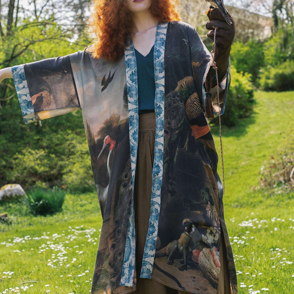 
                  
                    Model wearing Wild Beauty Opera Duster with antique lush florals and peacock – Market of Stars
                  
                