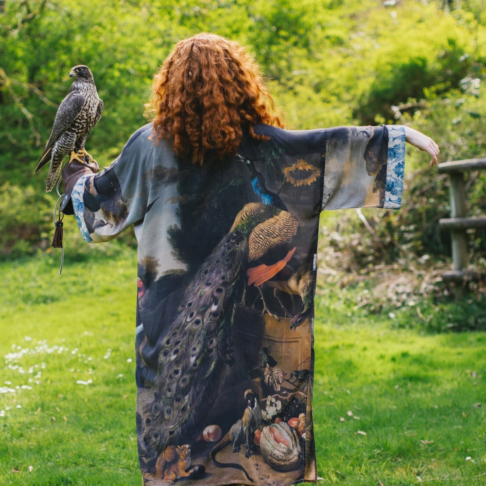 
                  
                    Model wearing Wild Beauty Opera Duster with antique lush florals and peacock – Market of Stars
                  
                