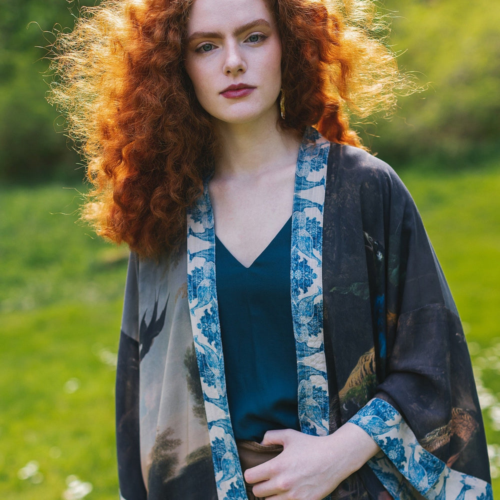 
                  
                    Model wearing Wild Beauty Opera Duster with antique lush florals and peacock – Market of Stars
                  
                