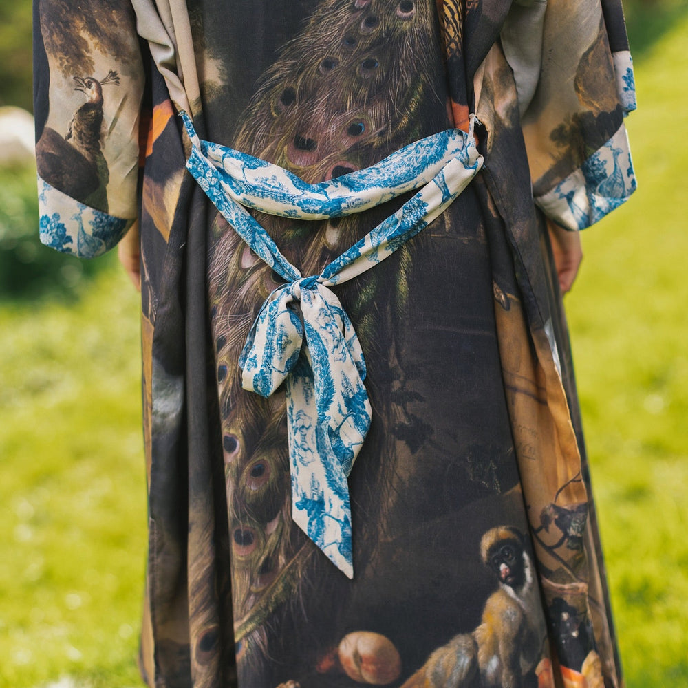 
                  
                    Model wearing Wild Beauty Opera Duster with antique lush florals and peacock – Market of Stars
                  
                