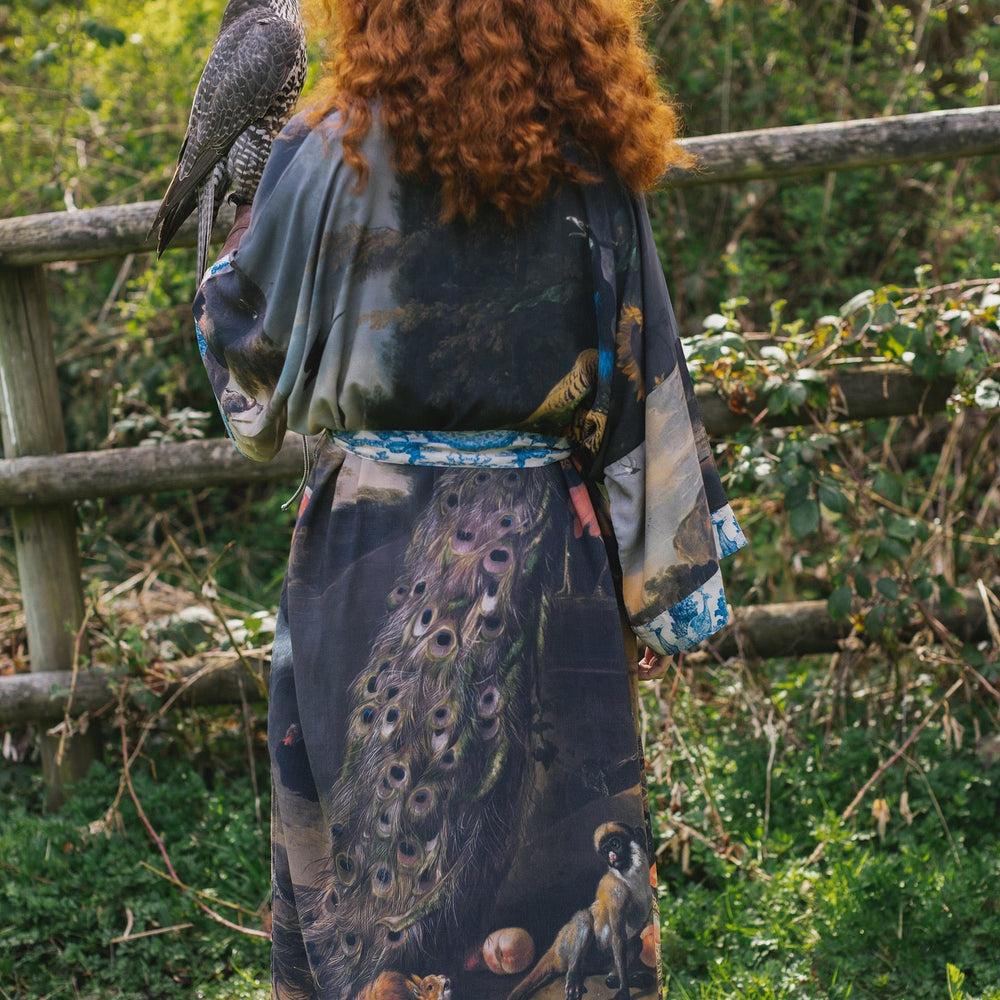 
                  
                    Model wearing Wild Beauty Opera Duster with antique lush florals and peacock – Market of Stars
                  
                