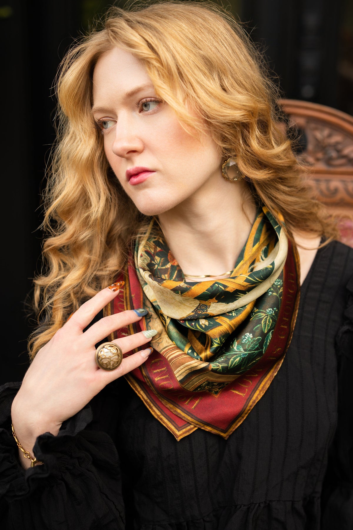 Model wearing a romantic silk scarf featuring antique tapestries, unicorns, mythical gardens and rich botanicals - Market of Stars