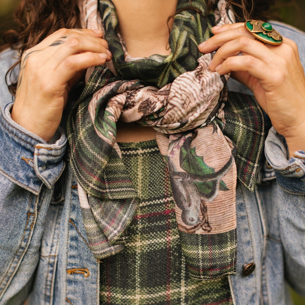 
                  
                    Model wearing a bamboo viscose scarf with a nostalgic print, snowflake wonder and the magic of the holiday season - Market of Stars
                  
                