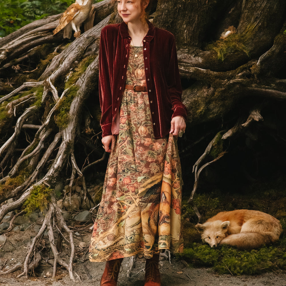 
                  
                    Model wearing a bamboo-viscose maxi length slip dress where even the unlikeliest of friends...a fox and a pheasant...find warmth in each other’s company. Created in collaboration with Charles van Sandwyck - Market of Stars
                  
                