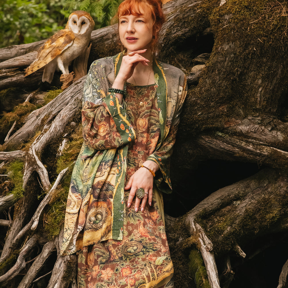 
                  
                    Model wearing a bamboo-viscose maxi length slip dress where even the unlikeliest of friends...a fox and a pheasant...find warmth in each other’s company. Created in collaboration with Charles van Sandwyck - Market of Stars
                  
                