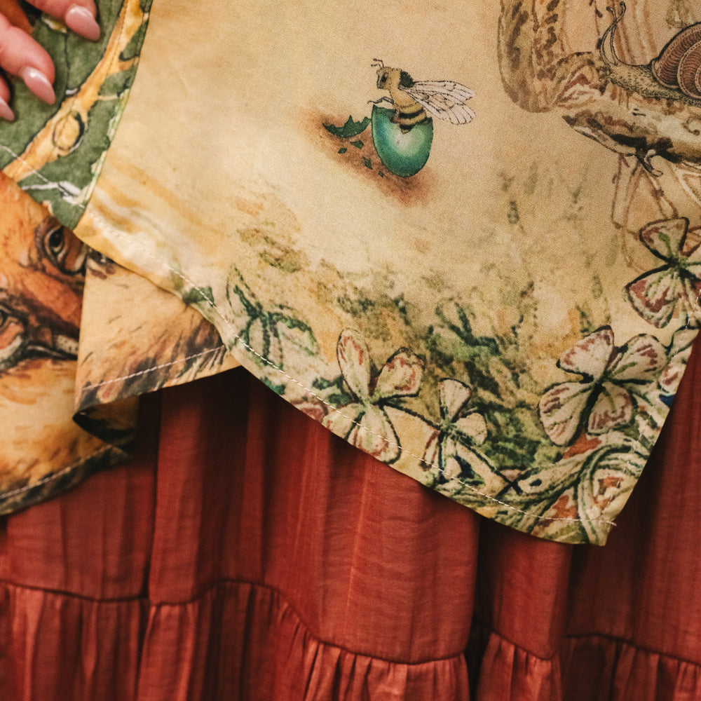 
                  
                    Model wearing a bamboo-viscose mid-length duster kimono robe where even the unlikeliest of friends...a fox and a pheasant...find warmth in each other’s company. Created in collaboration with Charles van Sandwyck - Market of Stars
                  
                