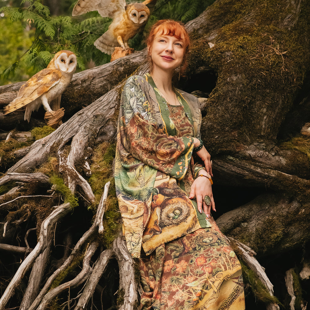 
                  
                    Model wearing a bamboo-viscose mid-length duster kimono robe where even the unlikeliest of friends...a fox and a pheasant...find warmth in each other’s company. Created in collaboration with Charles van Sandwyck - Market of Stars
                  
                